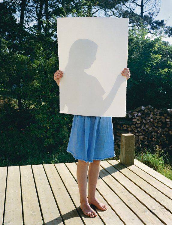 child with paper