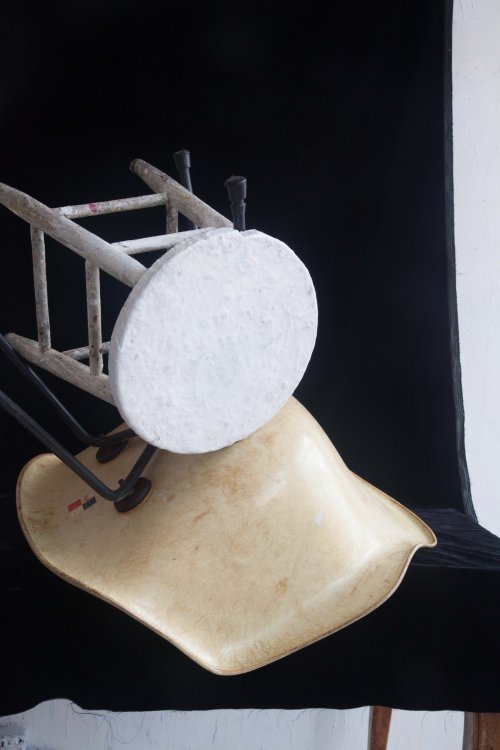 stool, chair and black backdrop