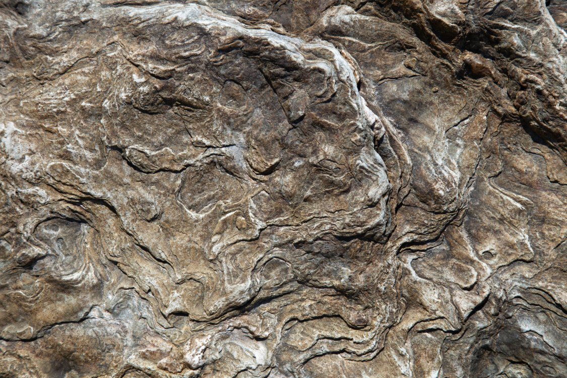 brown rock with curves